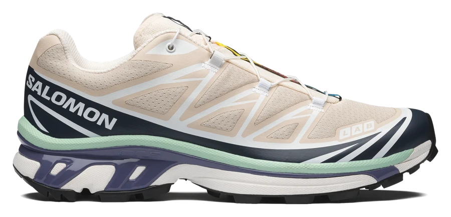 Salomon XT-6 with a cream mesh upper, dark overlays, pale green midsole and purple sole accents, side view